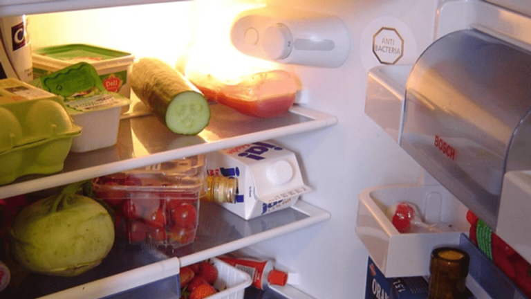 An open fridge with food in it